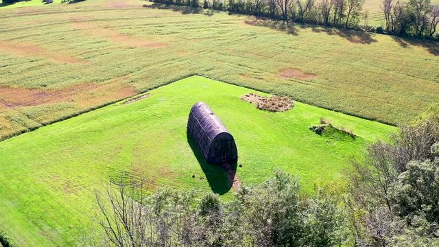 ?Aerial high fast approach to Native American replica Longhouse, Herr House property Lancaster County PA Concept: educational, replica, Native American culture, interactive exhibit
