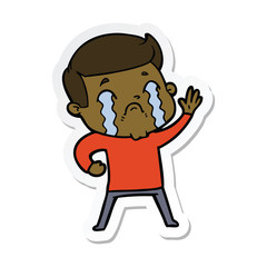 sticker of a cartoon man crying