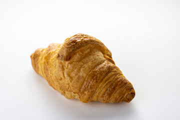 Fresh baked croissant isolated on white background
