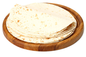 Tortilla wrap on wooden board isolated on white background