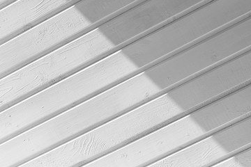 Obraz premium New white wooden wall with shadow