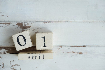 Wooden calendar show the date of April 01 , fool day on old white wooden background