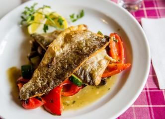 Roasted trout fillet with vegetable.