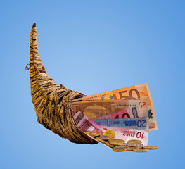cornucopia - euro banknotes and change in a horn of plenty 