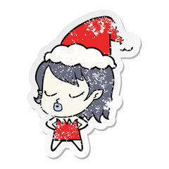 cute distressed sticker cartoon of a vampire girl wearing santa hat