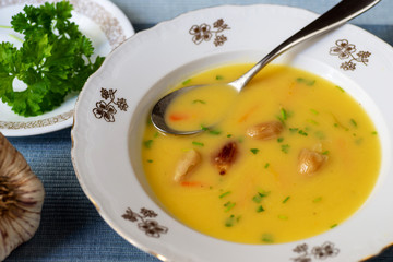 Vegetable soup with roasted garlic .