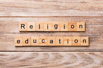 religion education word written on wood block. religion education text on wooden table for your desing, concept