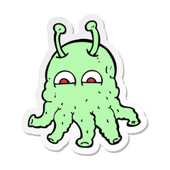 sticker of a cartoon space alien