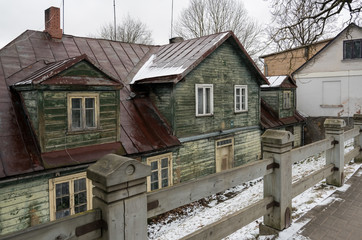 Wooden old houses on street.