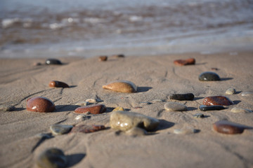 Fototapeta na wymiar Pebble stones by the sea.