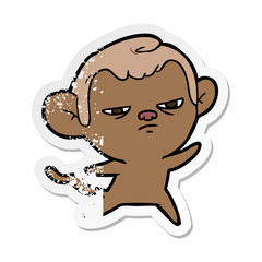 distressed sticker of a cartoon annoyed monkey