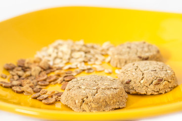 Healthy cereals and cookies on plate. Selective focus.