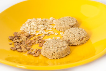 Healthy cereals and cookies on plate. Selective focus.