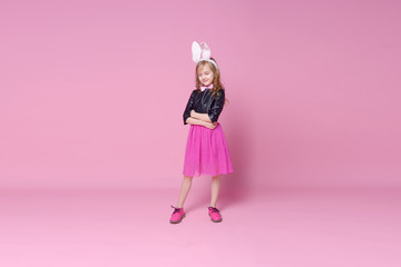 Funny baby girl in the form of Easter Bunny. Concept of holidays, beauty and fashion. Selective focus.
