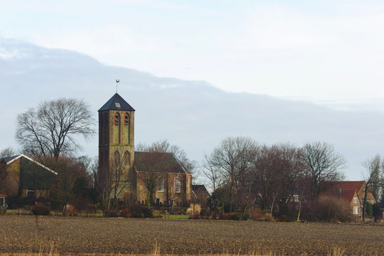 Old traditional church in Hippolytushoef at spring, Hollands Kroon, Netherlands.