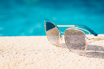 Beginning of the holiday booking season - a trip to the sea resort - summer holiday - sunglasses on...