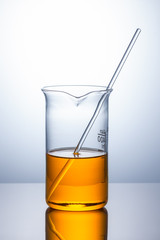 laboratory flask with orange liquid
