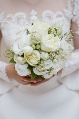 Bride holding flower bouquet 