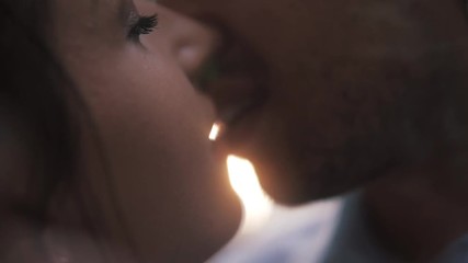 Close up portrait of a beautiful young couple waiting to kiss in their traveling time against sunset light. - Powered by Adobe