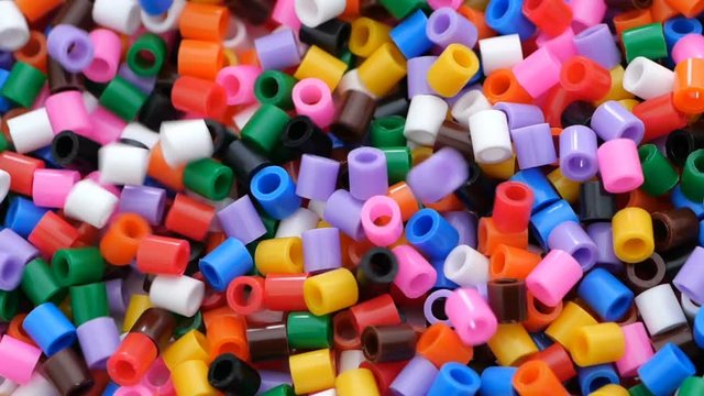 Colorful fusible plastic beads. Close up.
