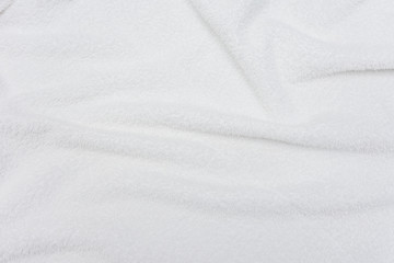 Fototapeta na wymiar white crumpled blanket, texture, top view