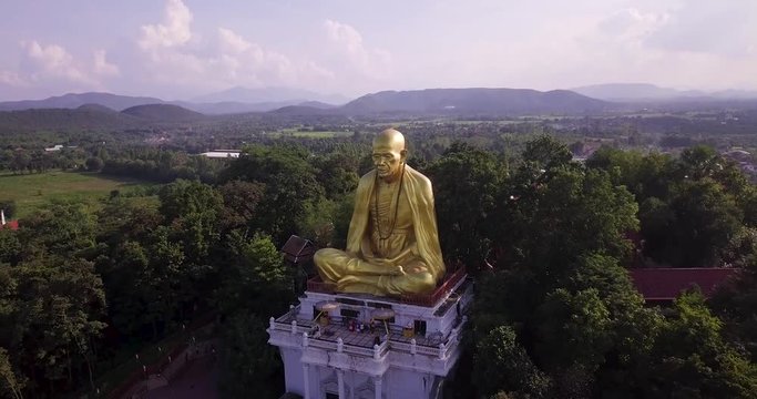 Monument of a very respected monk in Thailand, Kruba Srivichai. FLY BACKWARD