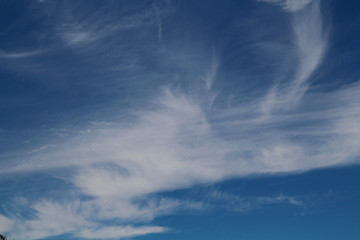 Fototapeta na wymiar White clouds against a blue sky,