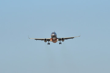 Passenger airplane landing at the airport