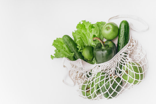 white mesh bag vegetables fruits isolated