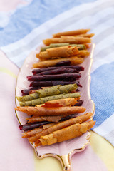 Closeup set of colorful pastillum rolls on tray