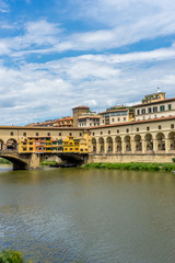 Obraz premium Italy,Florence, Arno, a large bridge over some water with Arno in the background