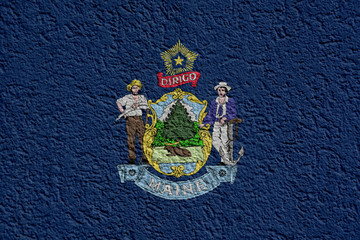 Fototapeta premium US State Politics Or Business Concept: Maine Flag Wall With Plaster, Background Texture