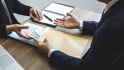 Dishonest cheating in business illegal money, Business man giving bribe money in business people to give success the deal contract of investment, Bribery and corruption concept
