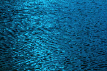Obraz premium Rippling blue water surface.water river for background