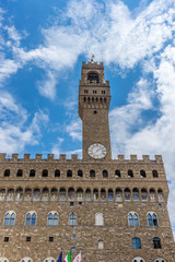 Fototapeta premium Italy,Florence, Palazzo Vecchio, a large clock tower in front of Palazzo Vecchio