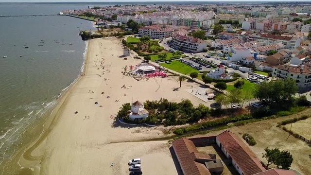 Popular river beach &ldquo;Praia dos moinhos&rdquo; in Alcochete, Portugal. Maintain  old wind mills in the waterfront