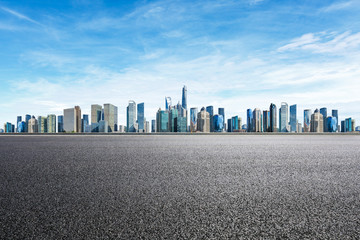 Empty asphalt road and panoramic city skyline with buildings in Shanghai