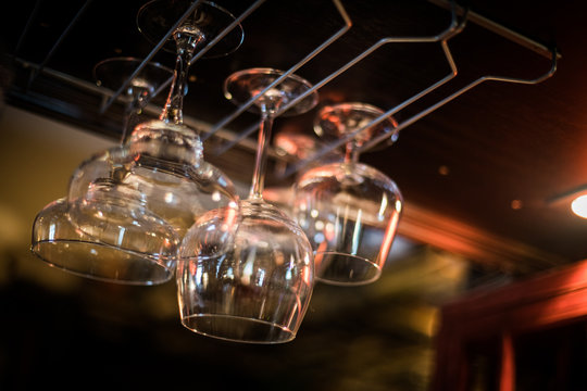 Hanging wine glasses in a pub