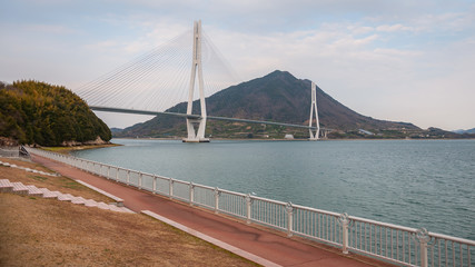View of Tatara Bridge, which connects Ikuchi Island with Omishima Island, seen from Omishima Island while on the Shimanami Kaido cycling tour starting from Onomichi and ending at Imabari.