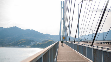 Tatara Bridge, which connects Ikuchi Island with Omishima Island, is the third bridge to cross while on the Shimanami Kaido cycling tour starting from Onomichi and ending at Imabari.