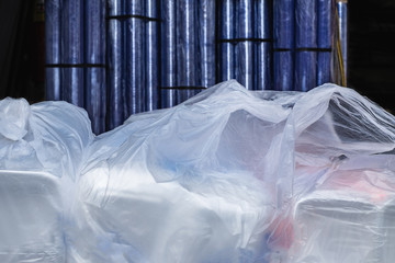 Rolls of plastic and styrofoam box in plastic bag for sell at a plastic shop in Thailand.