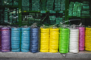 A shop selling colorful plastic rope and plastic packaging.