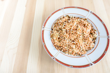 seasoning for soup yellow abstraction on a plate wooden background