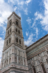 Fototapeta na wymiar Italy,Florence, Giotto's Campanile, a large clock tower on a cloudy day