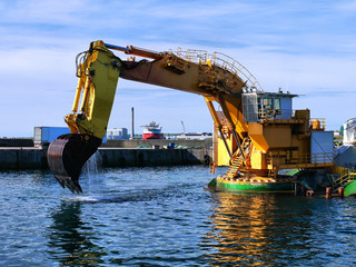 Backhoe Dredger "MP40" dredging operations in harbour.