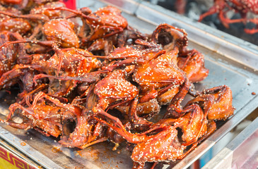 Grilled quail (quail to its small size. Used to make a variety of dishes, whether grilled, fried and delicious) Placed in the tray for sale in the local market, Thailand.