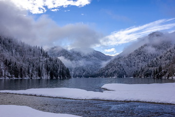 Lake Ritsa in winter covered with fog