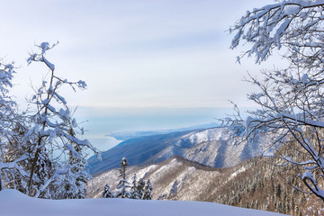 Winter landscape with a view of the mountains and clear sky