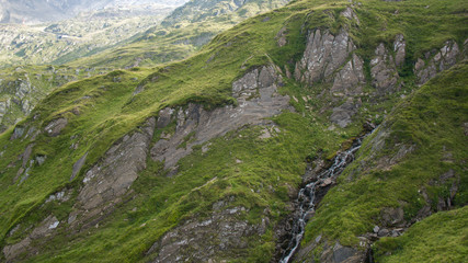 mountain boulders cliffs with water fall