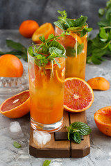 Homemade refreshing drink with bloody orange juice and mint